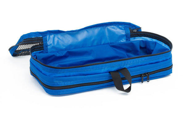 An empty and open Island (blue) Aether Small Aeronaut 45 Packing Cube mesh side up.